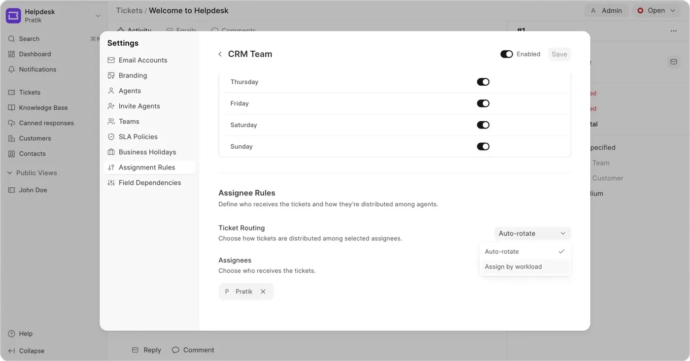 A team's assignment settings: working days toggled on and off, and ticket routing set to auto-rotate, with assign by workload as the other choice.